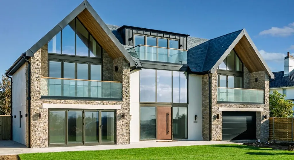 Contemporary house with glazed gables and a slate roof